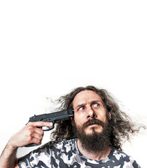 Portrait of a skinny man poiting a gun - isolated