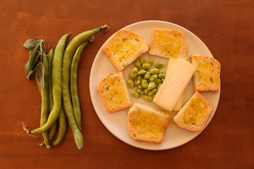 homemade bread with  extra virgin olive oil, fava beans and cheese