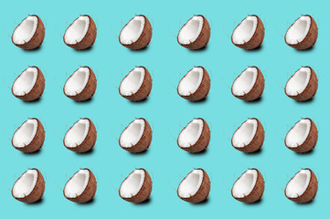  coconut pattern on a turquoise background. coconut halves are repeated many times