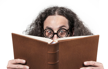 Eccentric, young nerd reading a book - obrazy, fototapety, plakaty