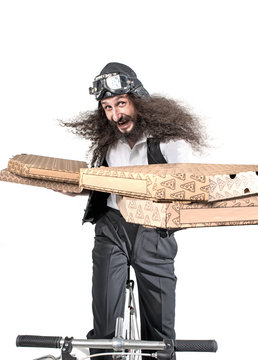 Cheerful pizza man on a bike