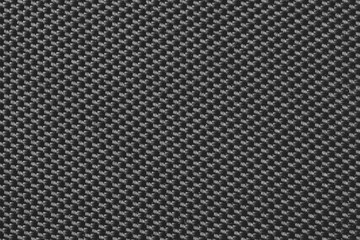 Wattled black fabric texture background. Close up. Top view.
