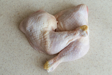 fresh chicken thighs isolated on light background