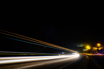 Light trails of cars at motorway in the night long exposure