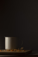 Corn kernels on a wooden table with a white metal