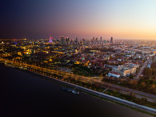 Fototapeta na wymiar Warsaw city center at dusk aerial view, day into night transformation.