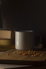 Corn kernels on a wooden table with a white metal