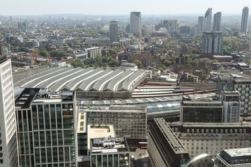 London cityscape with many dominants. In foreground see London waterloo station and behin him...