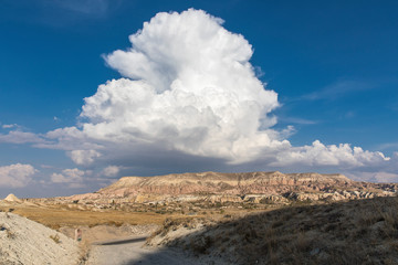 White interesting clouds over Cappadocia Valley, Nevsehir, Turkey.
