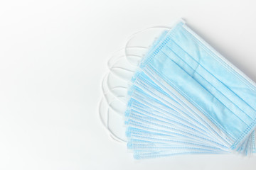 New surgical masks for coronavirus prevention on a white background. Healthcare concept. Medical tools.