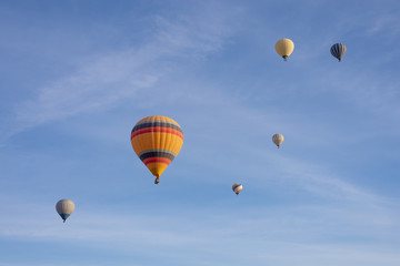 Fototapeta premium Hot air balloons flying in the blue sky in Goreme Cappadocia. Beautifull background texture. 