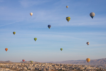 A lot of hot air balloons in the blue sky in Goreme Cappadocia. Beautifull background texture. Hot air ballons.