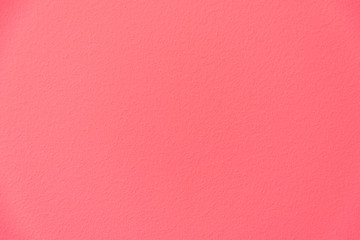 Coral colored background of the painted wall. Texture, base.