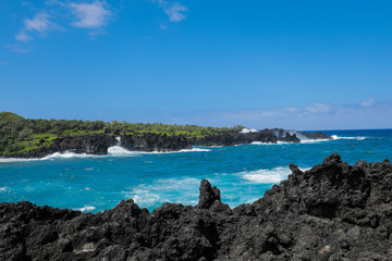 Hawaiian State Park near Black Sand Beach in Maui Hawaii on the Road to Hana with Turquoise Ocean and Volcanic Rock