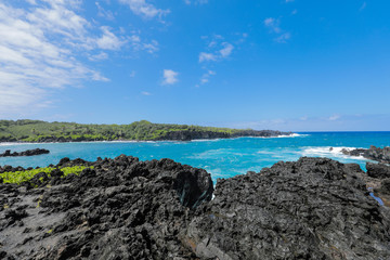 View of Volcanic Cliffs and Turquoise Pacific Ocean in the State Park on Road to Hana, Maui Hawaii
