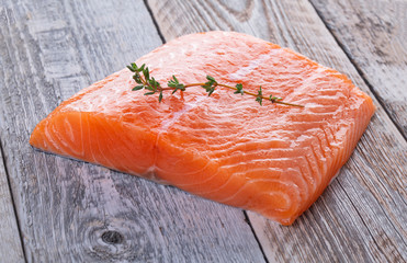 Fresh salmon filet with thyme sprig