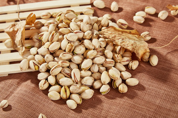 Charred cashew nuts in light containers