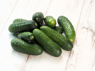 Fresh green cucumbers on wooden backgound