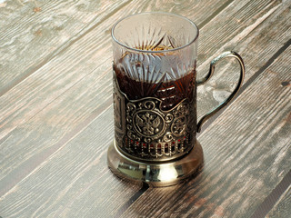 Tea in a glass with a silver cup holder