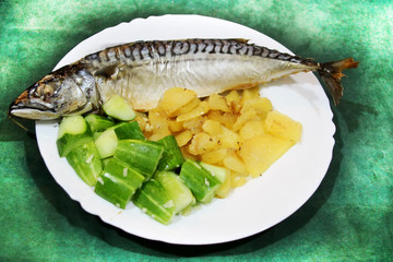 Baked mackerel with fried potatoes and cucumbers