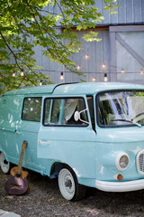 Classic vintage blue camper van parked in the park