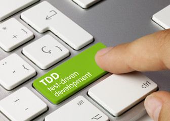 TDD test-driven development - Inscription on Green Keyboard Key.