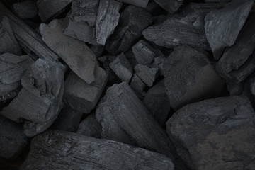 Many pieces of black charcoal
