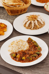 Ramadan. Arabic family dinner. Traditional arabic food. Close-up view. Eid Mubarak. Table with sharing plates food. Ramadan decoration. Lebanese cuisine. Starters, hummus, baklava, dates. Muslim