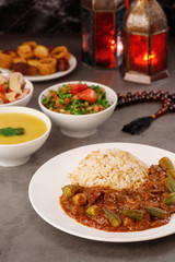Ramadan. Arabic family dinner. Traditional arabic food. Close-up view. Eid Mubarak. Table with sharing plates food. Ramadan decoration. Lebanese cuisine. Starters, hummus, baklava, dates. Muslim