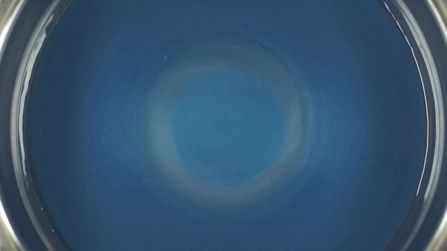 Rheoscopic fluid. Beautiful movement of particles in a liquid. Fantastic patterns and shapes.