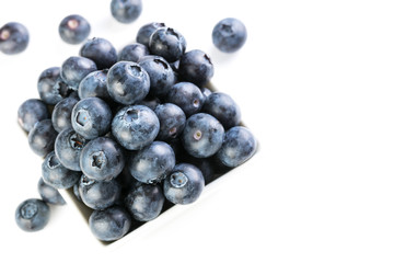 Fresh blueberries in a white plate