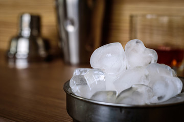 Ice cubes in the form of hearts in a metal container.