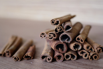 Cinnamon sticks on a wooden table top.