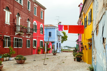 clothes is dried on a rope in the yard of the island of Burano, Venice, Italy