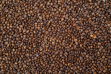 Aromatic roasted coffee beans on the table