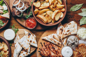 delicious European and Slavic cuisine on the big table waiting for guests. table with food, top view