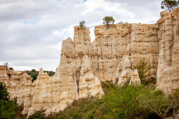 Natural chimneys made up of columns of soft rock, eroded by rain in Les Orgues d'illes sur Tet. Languedoc Roussillon, France - 339333846
