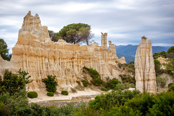 Natural chimneys made up of columns of soft rock, eroded by rain in Les Orgues d'illes sur Tet. Languedoc Roussillon, France - 339333874