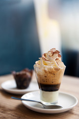 layered drink based on coffee with whipped cream