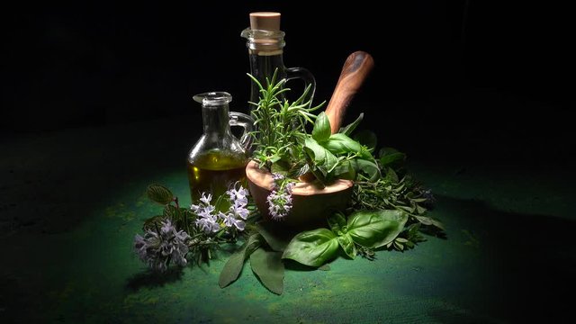 Homegrown and aromatic herbs on rustic background with rosemary and basil in 4K