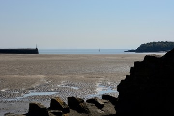 BARRY, VALE OF GLAMORGAN / WALES - APRIL 15 2020: elderly people take daily exercise in the sunshine during the COVID_19 lockdown making sure they are complying with social distance rules