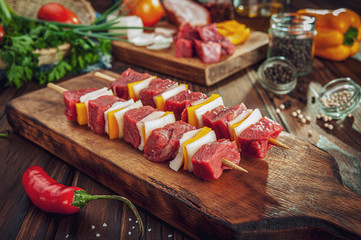 Raw meat stick with ingredients - Brazilian espetinho de carne