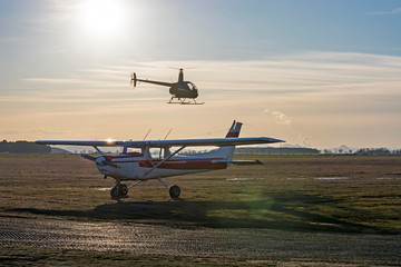 cessna plane and helicopter flying