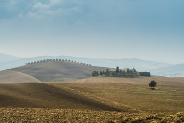 view of Tuscan fields and hills in Italy