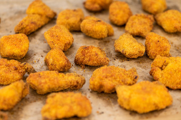 Vintage wooden table with fresh made Chicken Nuggets