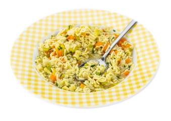 Alphabet Soup (selective focus) isolated on white background