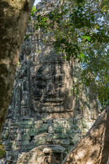 Fototapeta na wymiar Statue on top of a gate at Ankor Thom in Cambodia