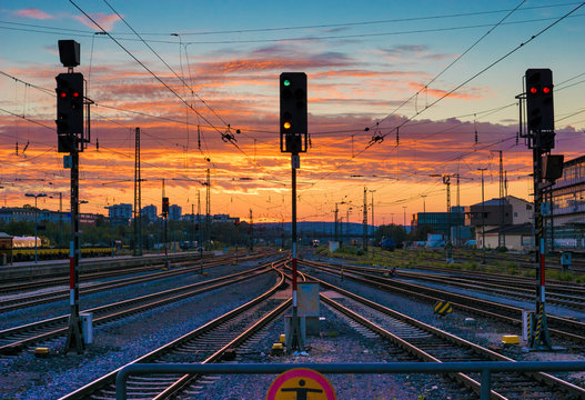 Stoplights At Railroad Tracks Against Sunset Sky