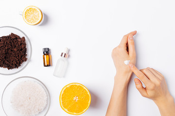 Homemade skin care, female's hands apply cream