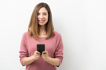Happy woman with a smartphone